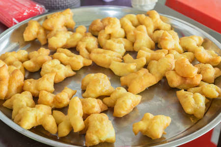long golden-brown deep fried strip of dough commonly eaten in Asian cuisines.
