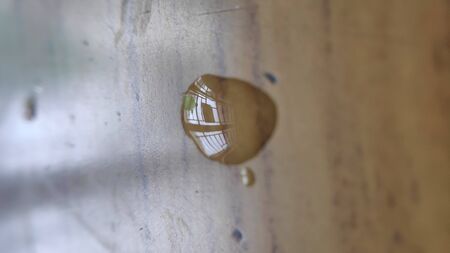 water drop on a wooden table with crystal viewの写真素材