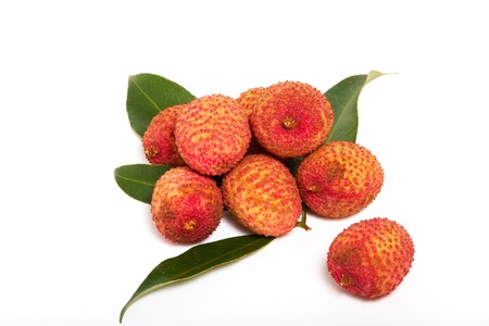 Lychee with leaves on a white background の写真素材