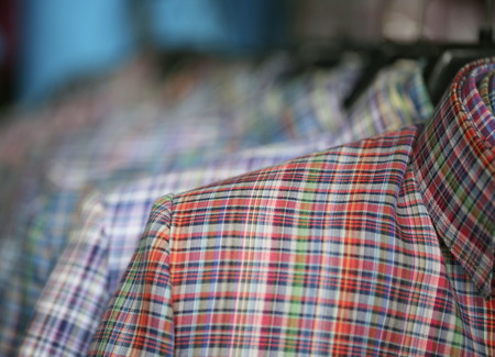 A colorful clothes is show in the store.