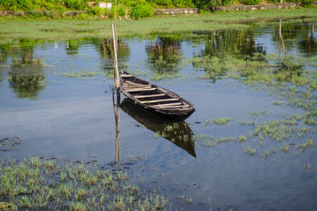 lonely boat at chilika lake odisha indiaの写真素材