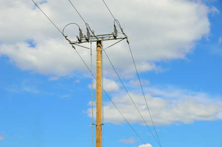 Electrical transmission pylon. Blue sky background.