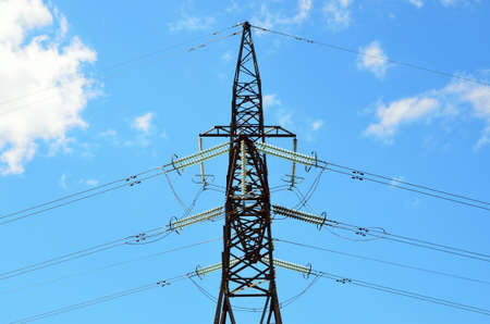 Electrical transmission pylon. High voltage. Blue sky background.