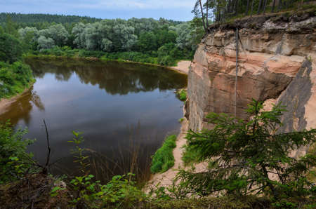 Sandstone outcrops. Erglu Cliffs, on the bank of the Gauja river.の写真素材