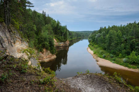 View from cliff on sandstone outcrops, river and forest. Erglu Cliffs, on the bank of the Gauja river.の写真素材