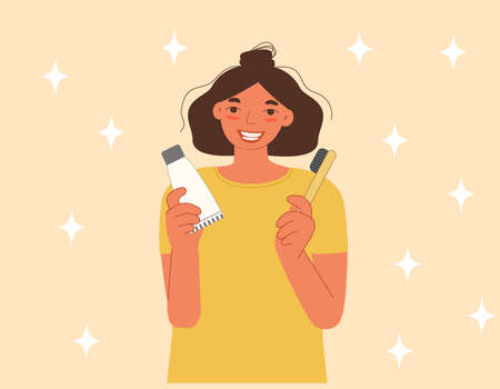 The girl is smiling and holding a toothpaste and toothbrush in her hands. The concept of care for the health of your teeth. Flat cartoon vector illustration.のイラスト素材