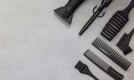 Background, frame with hairdressing tools on gray. Template for informationの写真素材