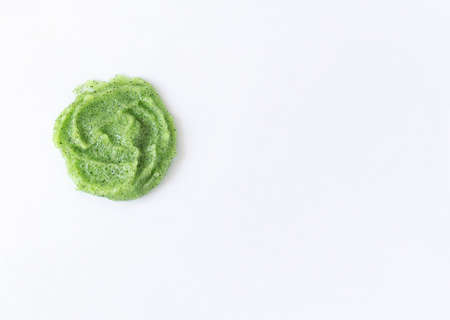 Gel texture with small particles of green scrub on a white background. Skin cleansing cream and copy spaceの写真素材
