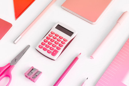 Background with pink office supplies. Folder, notebook, notebook, pencil in different shades of the same colorの写真素材
