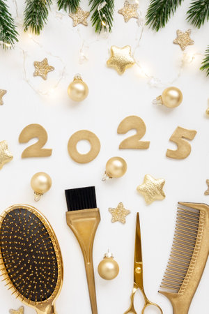 Numbers 2025 golden colored scissors and comb with fir twigs on white background. Vertical template greeting card of hairdresser or hair salon.の写真素材