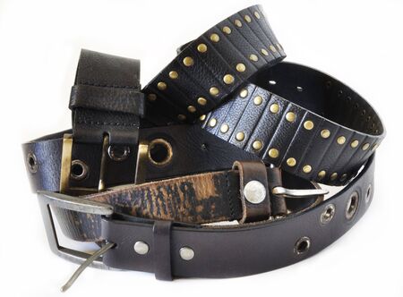 Two black belts over white backgroundの写真素材