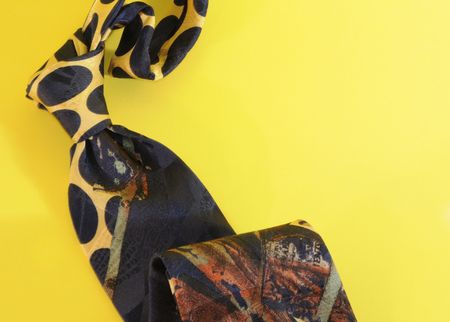 Necktie over yellow backgroundの写真素材