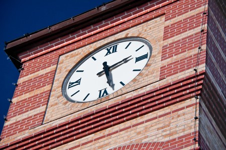 Overland Park city market clock tower under blue skyの写真素材