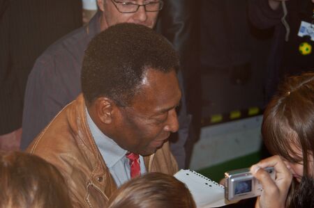 BERLIN, GERMANY - JUNE 7TH: Edson Arantes do Nascimento, Pele, signing autographs during the opening o the Pelestation Exhibition on June 7th, 2006.のeditorial素材