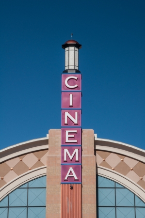 Movie theater cinema facade exterior tower under bright blue skyのeditorial素材