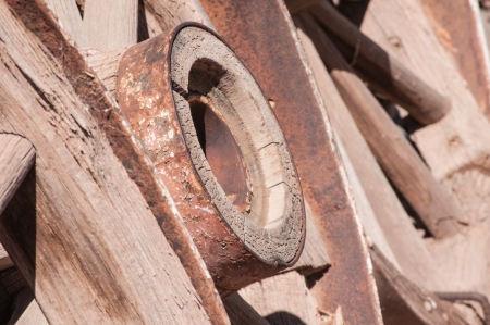 Old West Wagon Wheel otdoors under bright sunlightの写真素材