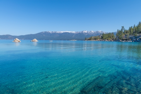 Beautiful blue clear water on the shore of the lake Tahoeの写真素材