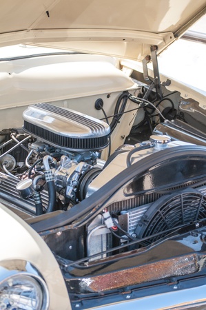Beautiful convertible classic car showing engine at car show