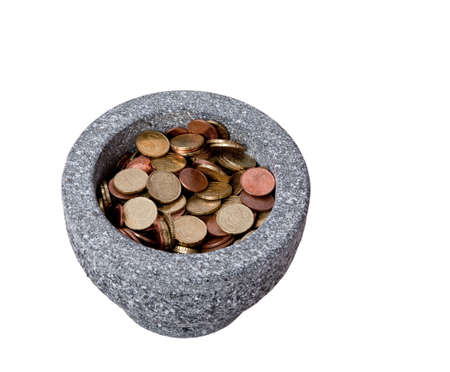 Euro-cents pieces in a mortarの写真素材