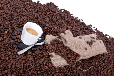 a nice cup of espresso with a lot of coffee beansの写真素材