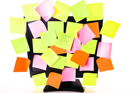 an overloaded monitor with post-itの写真素材