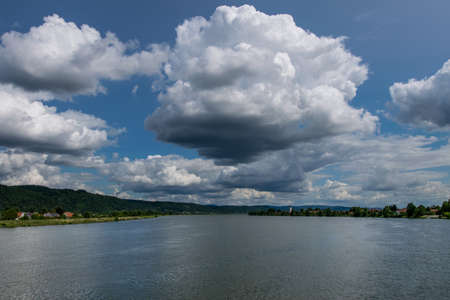 Big River with clouds on the sky in the bavarian forestの写真素材