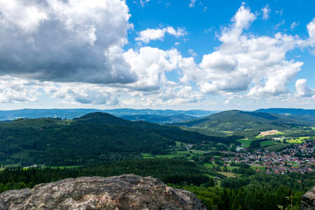 View from top of a mountain down in a valley in the bavarian forestの写真素材