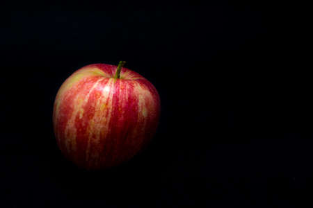 Red Apple isolated on a black backgroundの写真素材