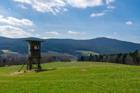 Hunter seat with clouds and fields in the bavarian forestの写真素材