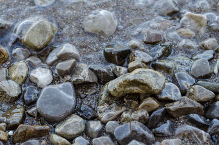 Wet stones in a lakeの写真素材