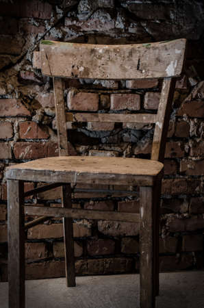 Chair in front of a brickの写真素材