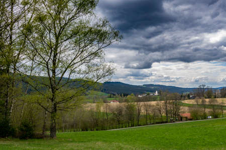 Clouds on the sky over the green landscape in the bavarian forestの写真素材