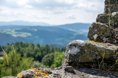 View in a valley from top of a castle on a sunny day in the bavarian forestの写真素材