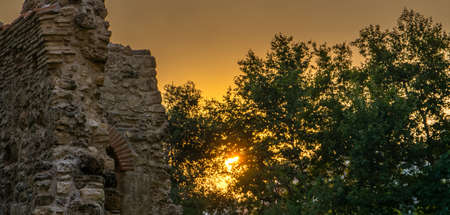 Little castle with sunset and treesの写真素材