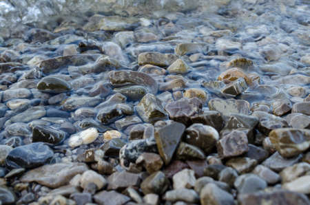 Wet stones in a lakeの写真素材