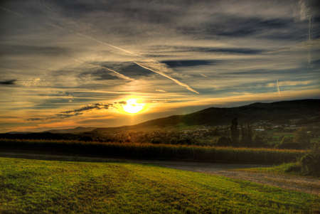 Sunset over a field in the bavarian forestの写真素材