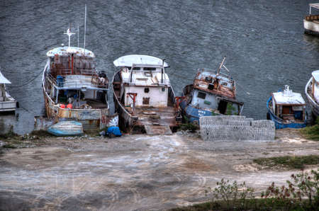 Old boats on the harbor in the Dominican Republicの写真素材