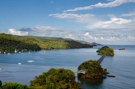 Bay with a bridge over the ocean and clouds on the sky in the Dominican Republicの写真素材