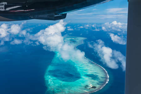 Maldives from the Sky with the blue sea and white sand and beach in the indian oceanの写真素材