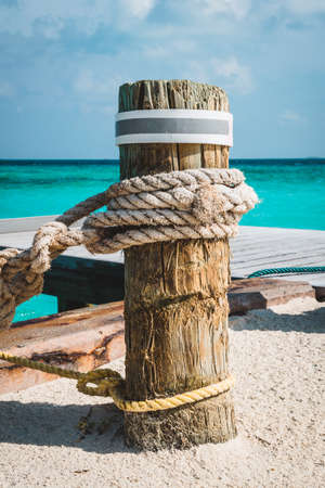 Jetty at the Maldives with turqoise water and blue sky