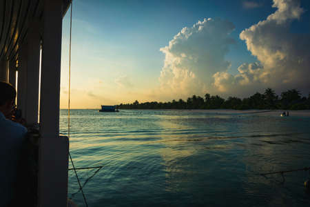 Maldives with the turquoise ocean and boats on the awesome waterの写真素材