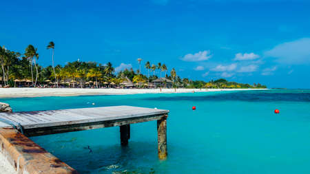 Jetty at the Maldives with turqoise water and blue skyの写真素材