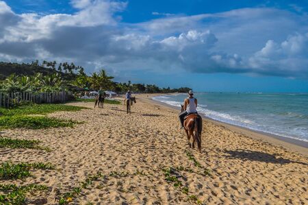 In Bahia in Brazil there are one of the most isolated beaches in the world. It is perfect for horseback riding. Once in a while you find a group of hippies enjoying their freedom.の写真素材