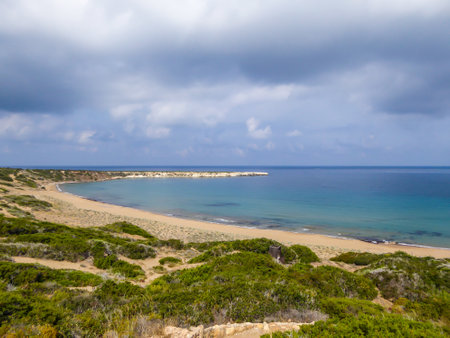 Panoramic view on Lara Beach, Cyprus from above. Hidden gem, not spoiled by tourists. Solitude, calm feelings, waves gently spreading on the beach. turquoise color of the water. Turtle hatching beachの写真素材