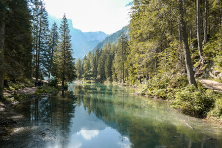 A view on the Pragser Wildsee, a lake in South Tyrolean Dolomites. High mountain chains around the...