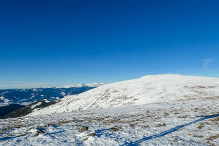 A drone shot of snow capped Alps in the region of Speikkogel in Austrian Alps. The whole are is...