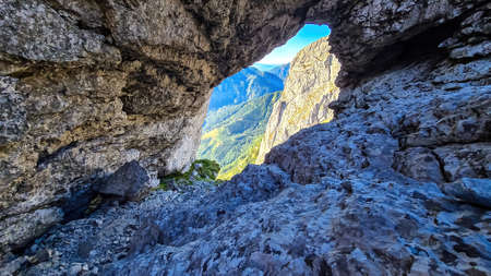 Panoramic view through a rocky hole on the mountain peak Zinken in the Hochschwab Region in Upper...