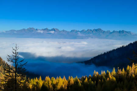A panoramic view on Lienz Dolomites, Austria from the top of Grosse Gamswiesenspitze, bathing in the...