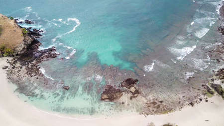 Top-down drone shot of an idyllic Koka Beach. Hidden gem of Flores, Indonesia. Beauty in the nature....
