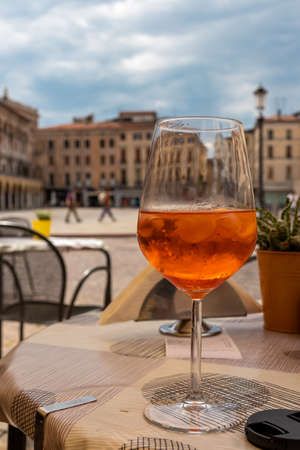 Typical italian alcoholic aperitif (aperitivo) served in a bar on  Piazza delle Erbe in Padova,...